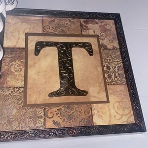 Large framed metal and glass “T”
